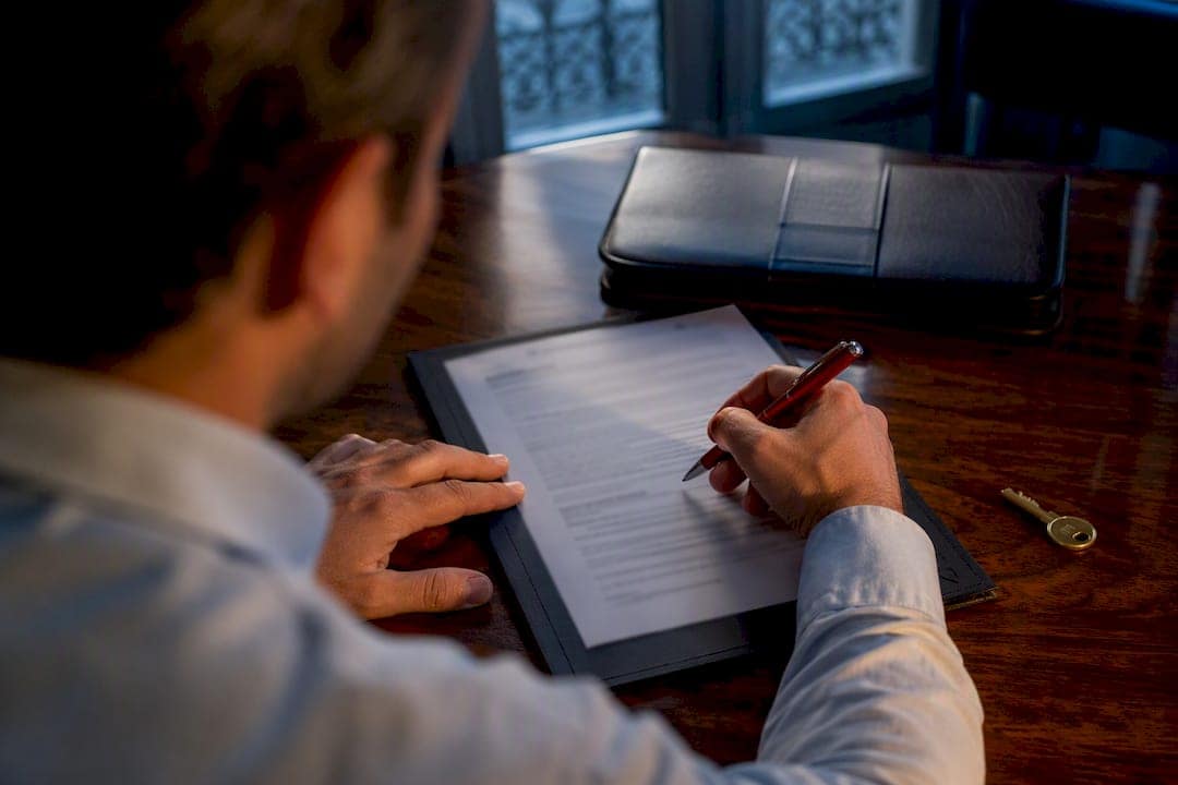 Buyer signing Spanish property deposit agreement